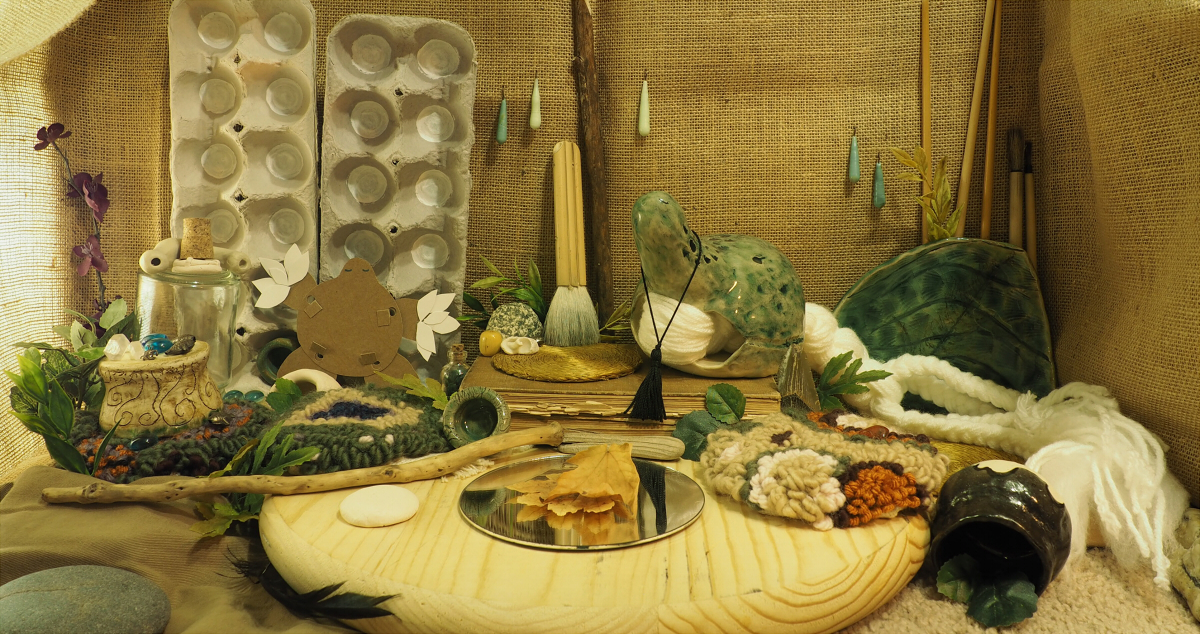 A photo of a tan and green nature-themed dollhouse room.