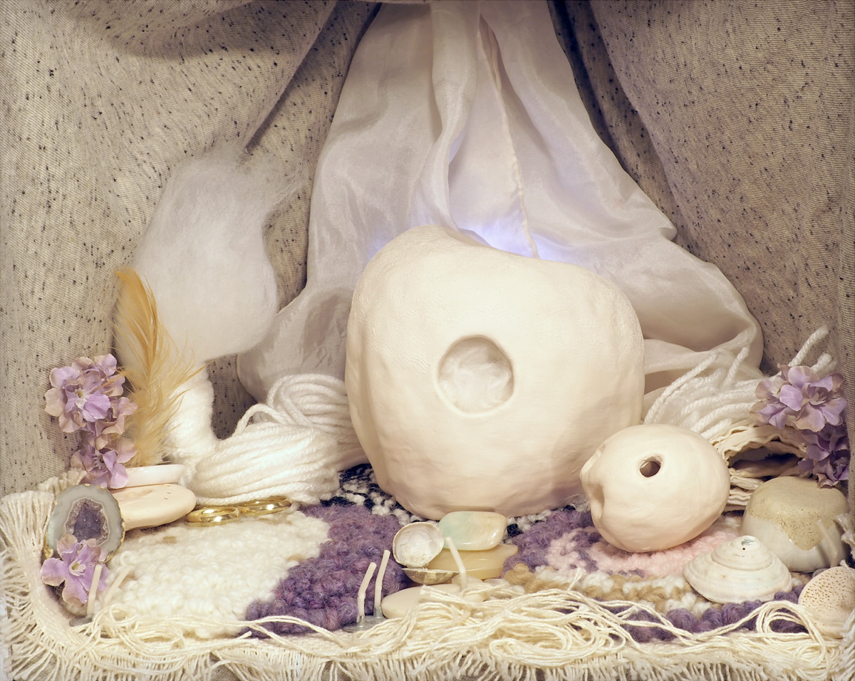 A photo of a serene white and purple moon-themed dollhouse room.