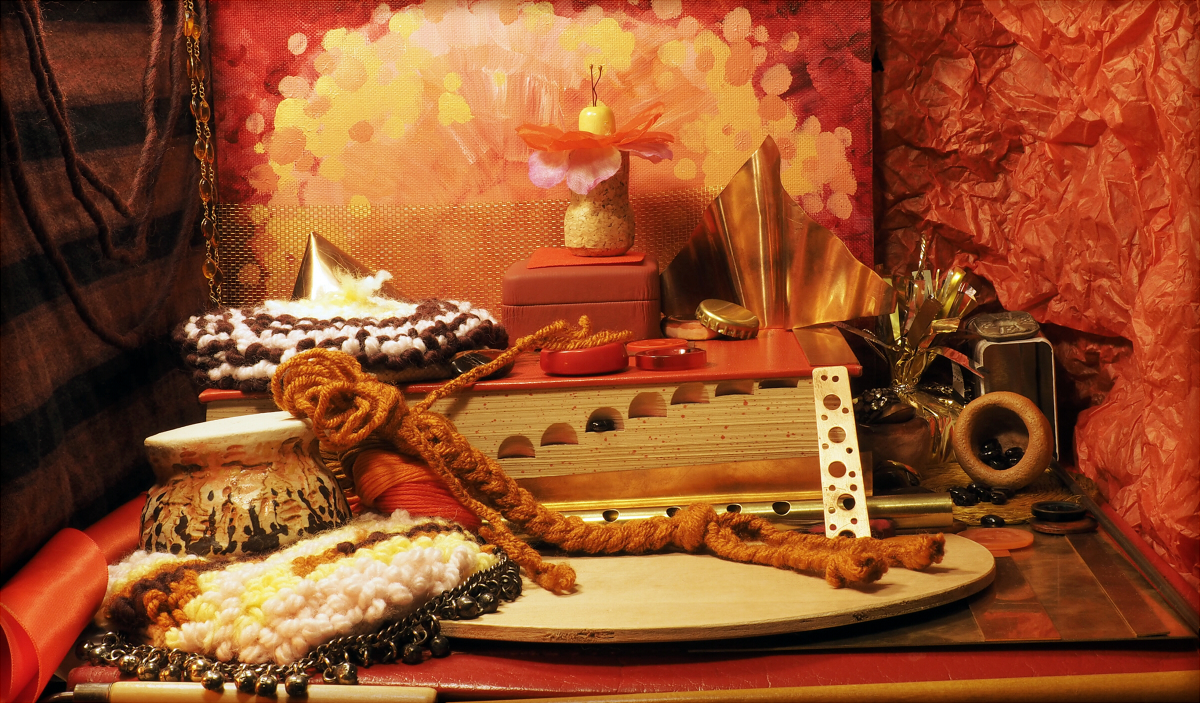 A photo of a warm red fire-themed dollhouse room.